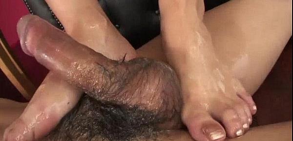  Yui loves using her oil and her feet to make this guy cum hard